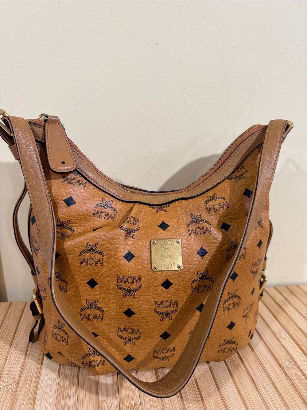 Authentic MCM Cognac Visetos Monogram Hobo Shoulder Bag with Gold Plaque
